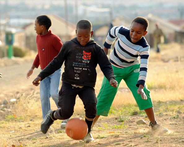 African Children Playing Football