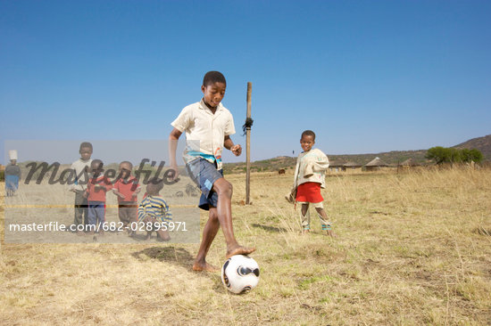 African Children Playing Football