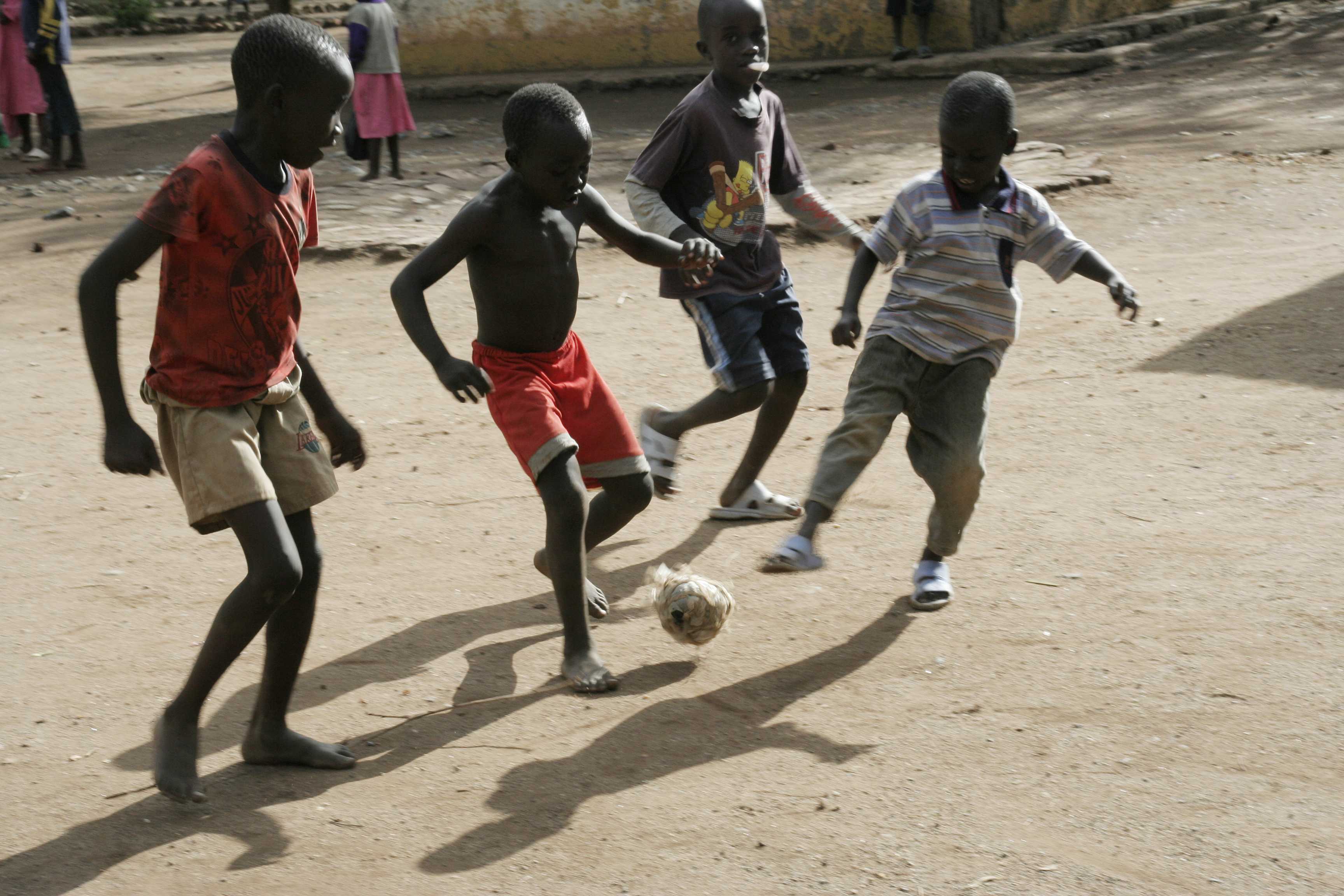 African Children Playing Football