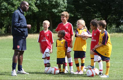 Children Playing Football At School