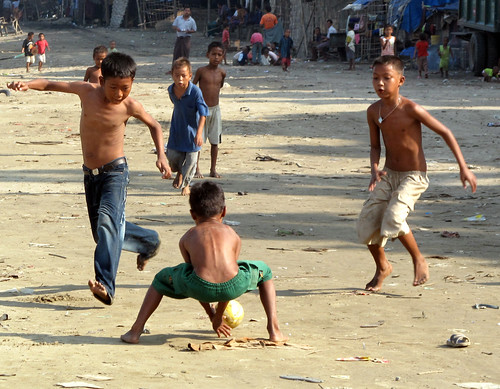 Children Playing Football In Street