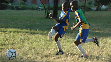 Children Playing Football In Street