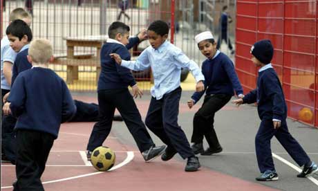 Children Playing Football In Street