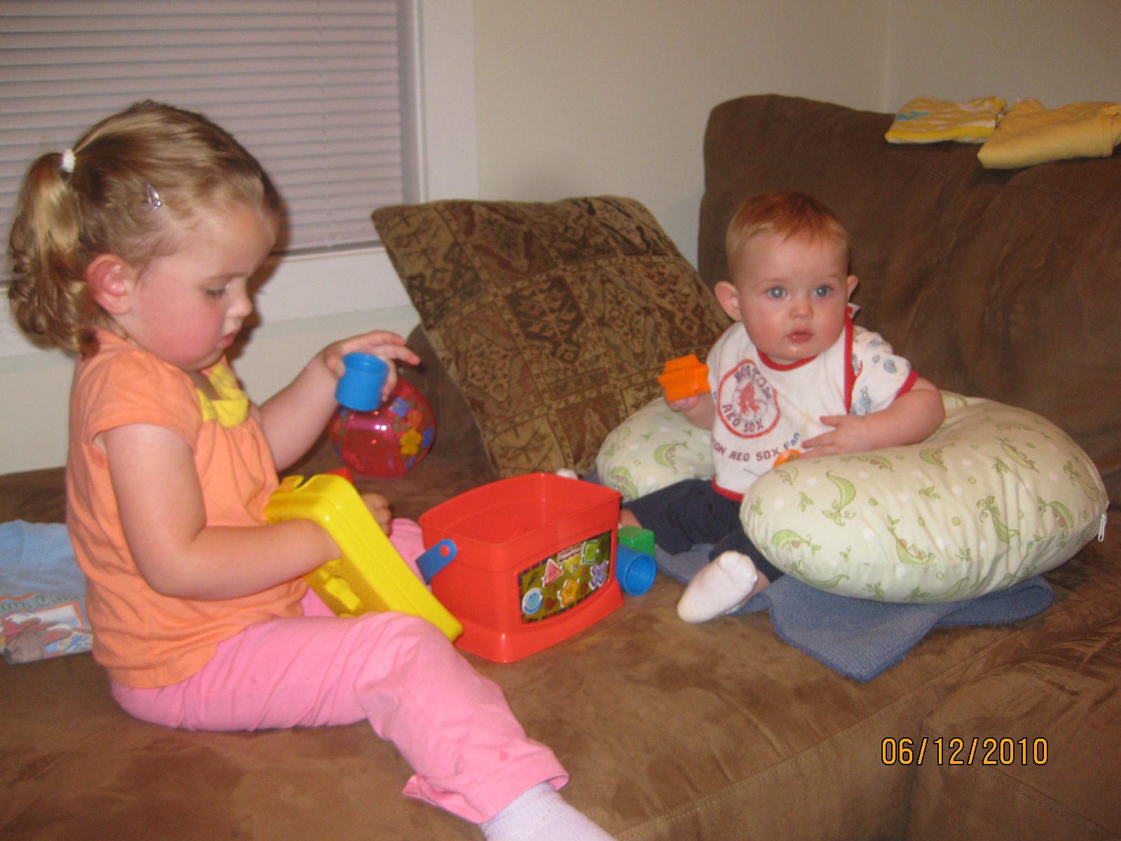 Children Playing Together With Toys